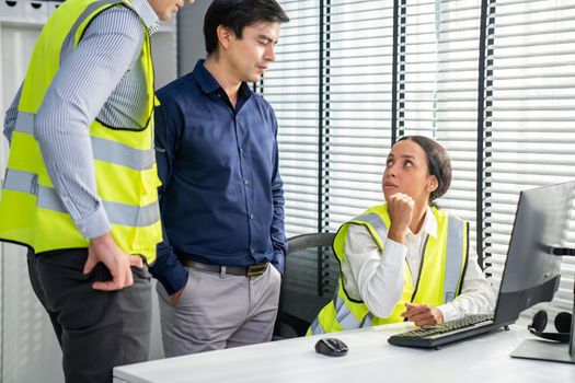 Competent engineers create blueprints and plans and present them to their boss. Architectural investors working with engineers for engineering project.