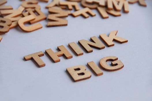 Think big text on white cover background. Inspirational concept.
