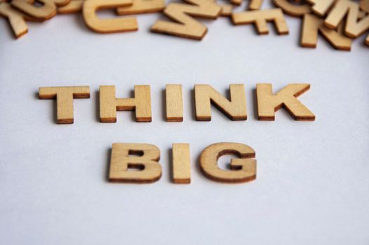Think big text on white cover background. Inspirational concept.