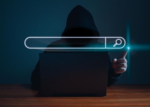 Hackers work on laptops in the dark. The concept of information security in the Internet network and information espionage.