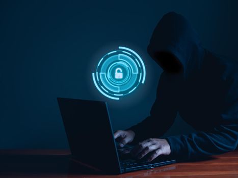 Hackers work on laptops in the dark. The concept of information security in the Internet network and information espionage.