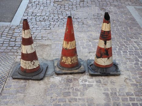 three traffic cones to mark road works or temporary obstruction traffic sign