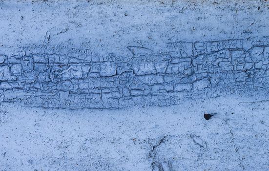 Texture of dried cracked blue-green paint on an abandoned wall. Abstract Grunge Painted.