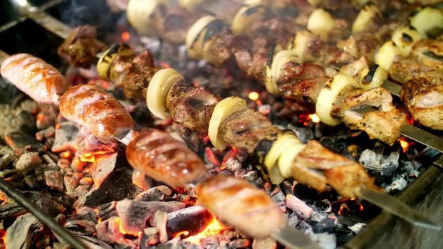 Shish kebab roasting on the grill. BBQ party. High quality photo