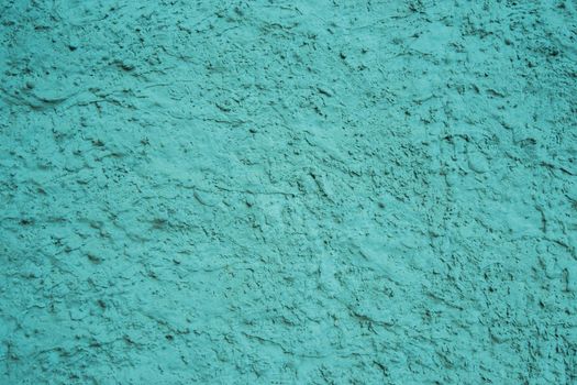 Blue abstract background..Background from blue stucco. Uneven surface of old paint.