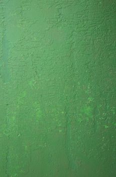 Green abstract background. Texture of old green paint. Background from green stucco.