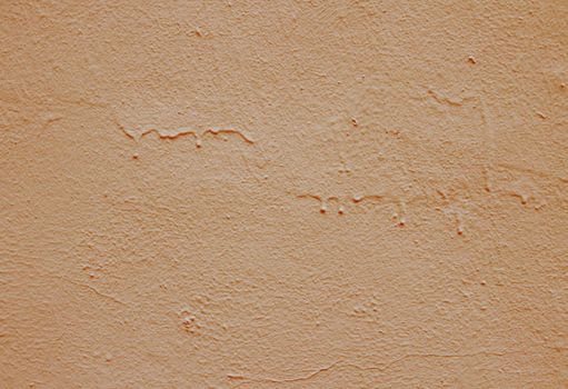 Old peeling paint on the wall. Brown abstract background..Beautiful brown textured stucco on the wall..Background from brown stucco..Background from brown stucco.