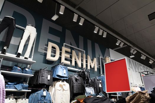 store interior with a wide selection of stylish denim clothes for boys and girls.