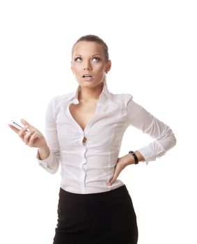 Sexy young serious business woman talk on cell phone isolated