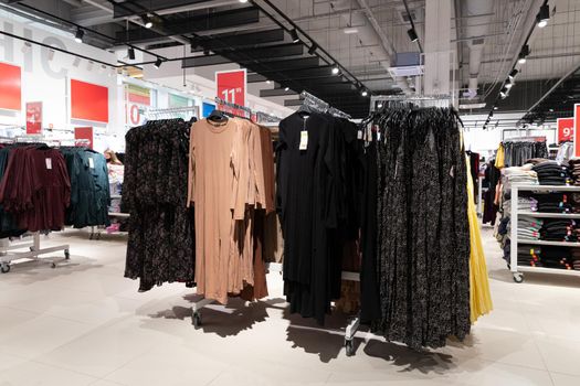 fashion store for women, evening dresses on a hanger, a wide selection of goods.