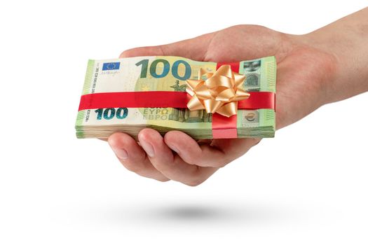 Gift of money. A pack of 100 euro bills in a male hand is isolated on a white background. Money gift concept for birthday or christmas