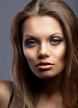 beautiful and sexy young serious woman look at you