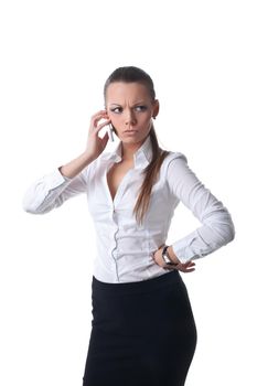 Sexy young serious business woman talk on cell phone isolated