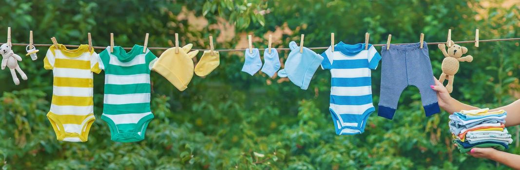 washing baby clothes. Linen dries in the fresh air. Selective focus. nature.