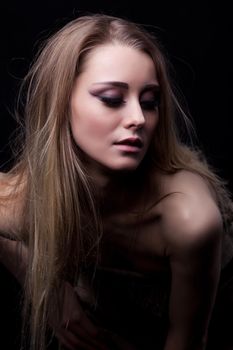 Studio portrait of beautiful blonde young woman