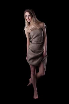 Full length portrait of blonde young woman in dress