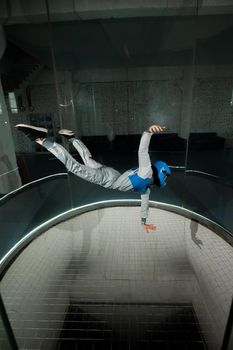 A woman flies in a wind tunnel. Free fall simulator