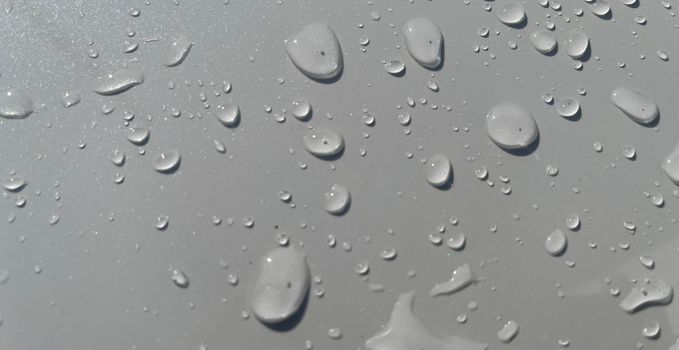 Water droplets perspective through white color surface good for multimedia content backgrounds, fresh dew