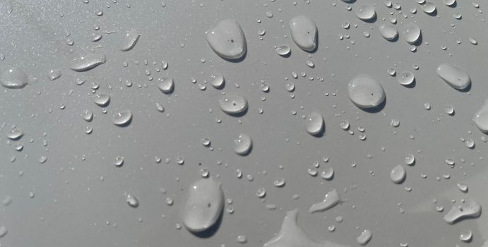 Water droplets perspective through white color surface good for multimedia content backgrounds, fresh dew