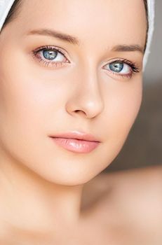 Skin care and beauty routine, beautiful woman with white towel wrapped around head, skincare cosmetics and face cosmetology, close-up portrait