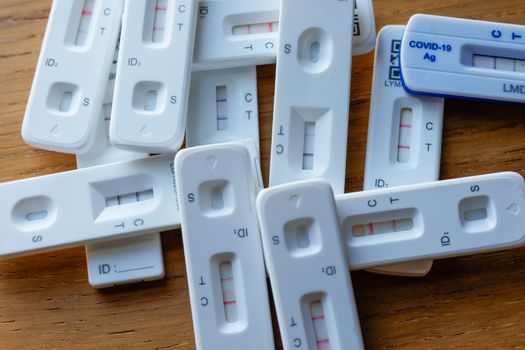 Pile of positive Covid-19 rapid home lateral flow antigen tests