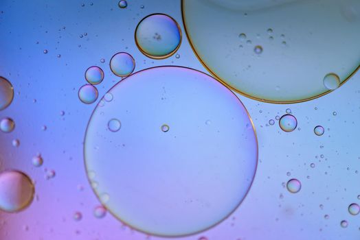 Oil drops in water. Abstract psychedelic pattern image multicolored. Abstract background with colorful gradient colors. Dof.