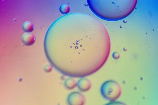 Oil drops in water. Abstract defocused psychedelic pattern image multicolored. Abstract background with colorful gradient colors. DOF