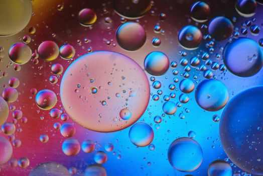 Oil drops in water. Abstract defocused psychedelic pattern image multicolored. Abstract background with colorful gradient colors. DOF