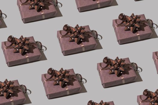 Brown gift box pattern with bow on gray background. Christmas minimalist concept photo. High quality photo