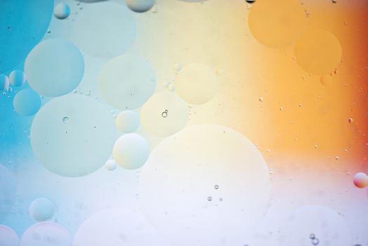 Oil drops in water. Abstract psychedelic pattern image rainbow colored. Abstract background with colorful gradient colors. DOF