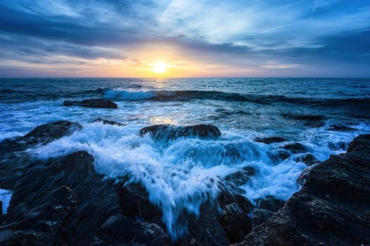 Blue hour in the sunrise at the sea shore. Horizontal view