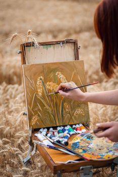 Professional artist working on beautiful still life painting