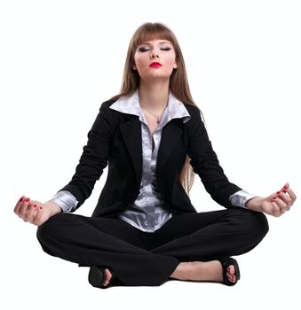 Yong business woman sit and relax in yoga pose lotos