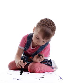 Cute little girl drawing on floor. Isolated on white