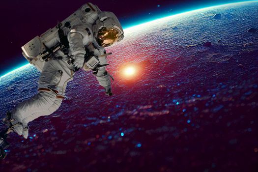 Astronaut spaceman do spacewalk while working for space station in outer space . Astronaut wear full spacesuit for space operation . Elements of this image furnished by NASA space astronaut photos