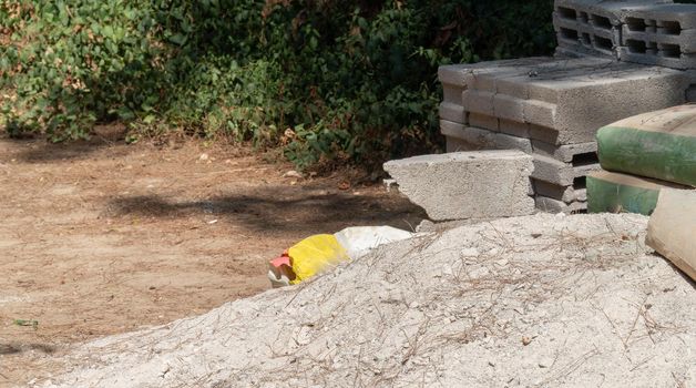 Building materials - sand, cement bags, concrete blocks. High quality photo