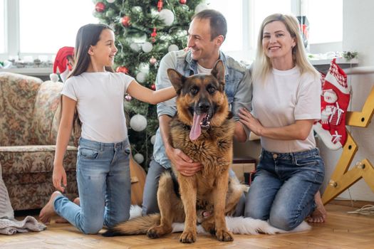 Christmas Family Portrait In Home Holiday Living Room, Kid and dog play, Present Gift Box, House Decorating By Xmas Tree.