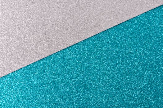 Shiny and glittering surface. Silver and blue, turquoise, abstract background. Events, celebrations. Trendy backdrop for your design. Texture with glitter