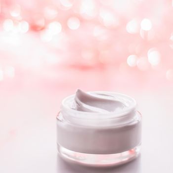 Cosmetic branding, gift and spa concept - Facial cream moisturizer jar on holiday glitter background, moisturizing skin care as lifting emulsion, anti-age cosmetics for luxury beauty skincare brand