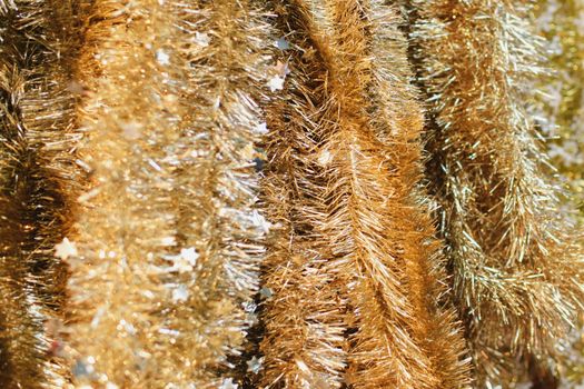 Golden tinsel for decoratin a Christmas tree