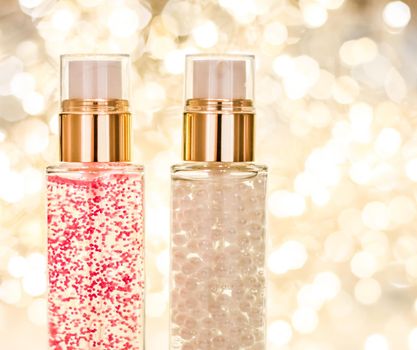 Cosmetic branding, blank label and glamour present concept - Holiday make-up base gel, serum emulsion, lotion bottle and golden glitter, luxury skin and body care cosmetics for beauty brand ads
