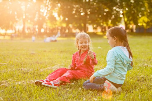 Beautiful little girls enjoying outside.