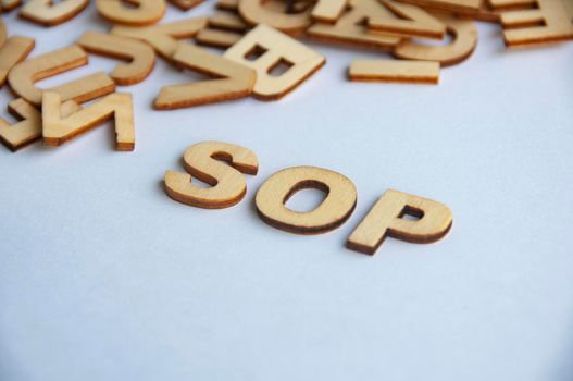 Standard operating procedures wooden text on while cover background. Social distancing concept.