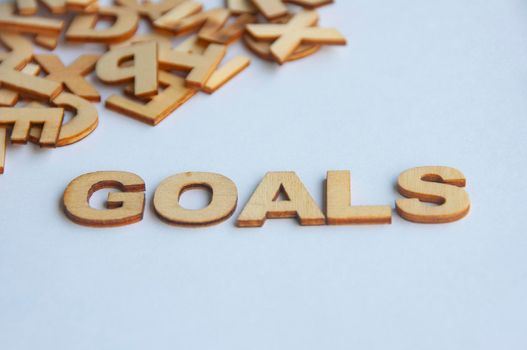 Goals text on while cover background. Setting goals concept.