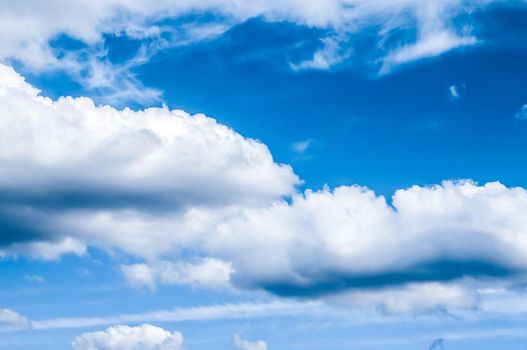 Nature backdrop, solar energy and spiritual concept - Blue sky background, white clouds and bright sunlight