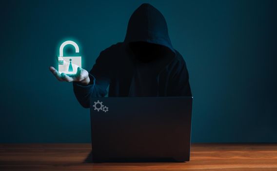 Hackers work on laptops in the dark. The concept of information security in the Internet network and information espionage.