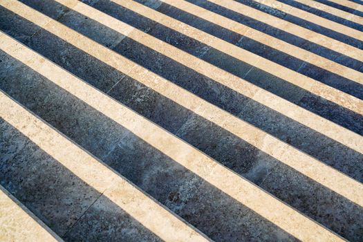 Staircase in the city, black and white pattern on the stairs on a sunny day