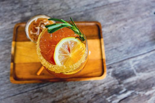 Fresh summer orange drink mocktail cosmopolitan pour in glass beverage business.