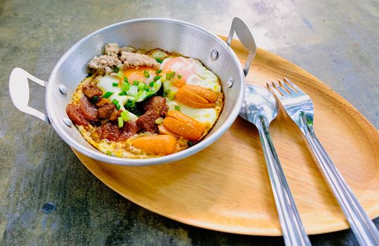fried egg with tomato bacon in pan breakfast morning business food still life