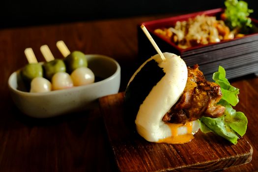 Hirata buns.  Japanese steamed buns filled with pork chashu, tempura, karaage. Japanese traditional food